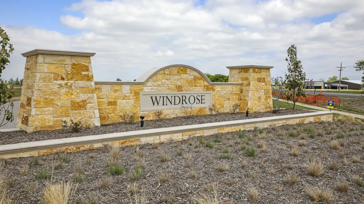 The stone entrance monument at Windrose, Pilot Point